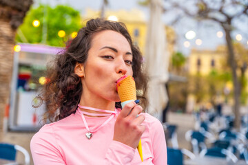 Sensual woman eating an ice cream in the city