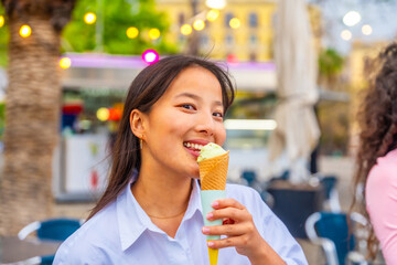 Chinese woman eating an ice cream in the city