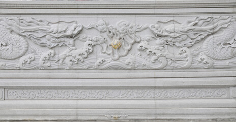 Closeup of The front wall of the central temple was carved with an ornate white dragon at Fo Guang...