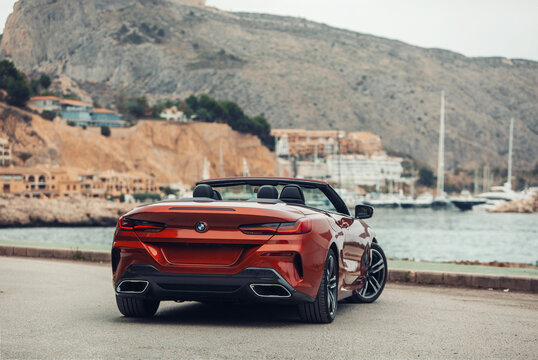 BMW 8 series G14 convertible at the parking of a sea shore 