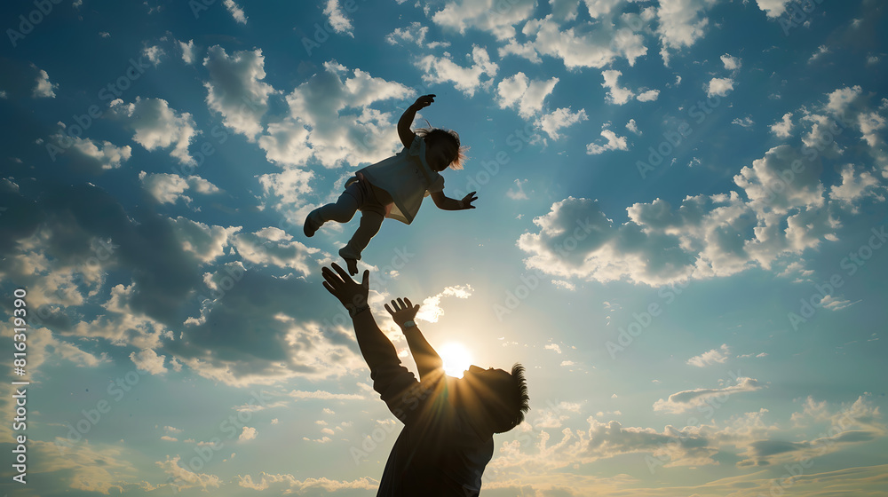 Wall mural dad plays with his daughter throws child up into sky with his hands happy kid father of daughters pl