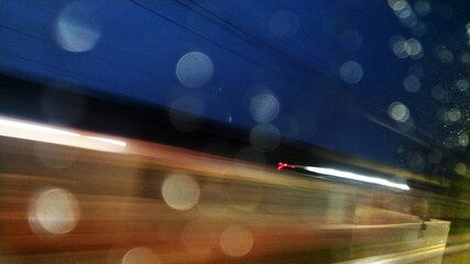 fast Blur background in the street water drops on the car window