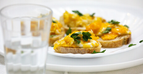 Healthy breakfast, toast with avocado, eggs and tomatoes