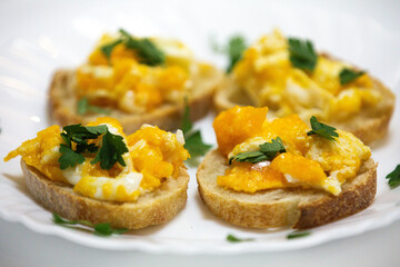 Healthy breakfast, toast with avocado, eggs and tomatoes