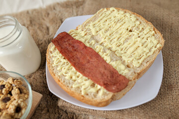 Bread with smoked beef on a plate for breakfast and coffee break