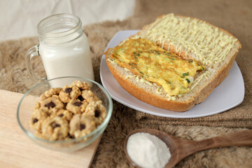Bread with scrambled egg sandwich on a plate for breakfast and coffee break