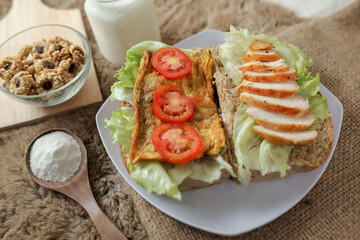 Big breakfast, bread, chicken slice, tomato, lettuce, smoked beef, egg, salad with milk. Bread sandwich fresh and healthy food meal lunch dinner breakfast slices of sandwiches.
