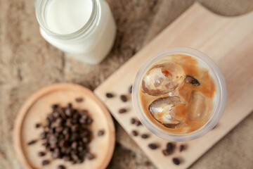 Delicious iced coffee, mocca, and chocolate drinks with coffee beans on white wooden table	
