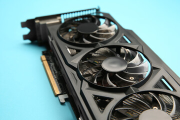 One graphics card on light blue background, closeup