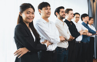 Business team standing, join and link hand together in line symbolize successful business...