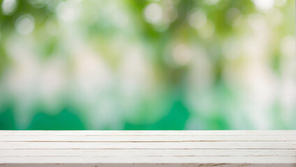 Fototapeta premium Empty white wooden table for product display with green Abstract blurred bokeh background, backdrop with copy space