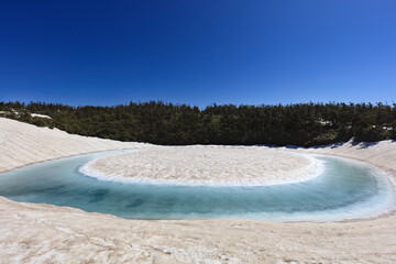 Hachimantai Kagaminuma with melting snow