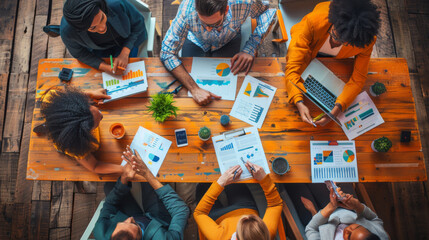 A diverse group of professionals discussing financial data in a collaborative workspace.
