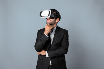 Smart caucasian businessman thinking and planning strategy while using VR glasses. Professional...