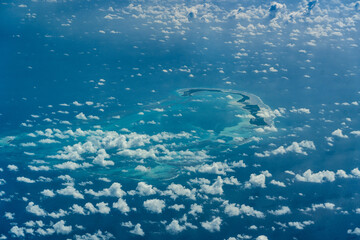 aerial landscape view of Farquhar Atoll in the territory of Seychelles, located in Indian Ocean - partly covered with clouds 
