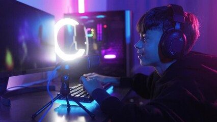 Young gamer streaming while playing video game online. E-sports competition concept