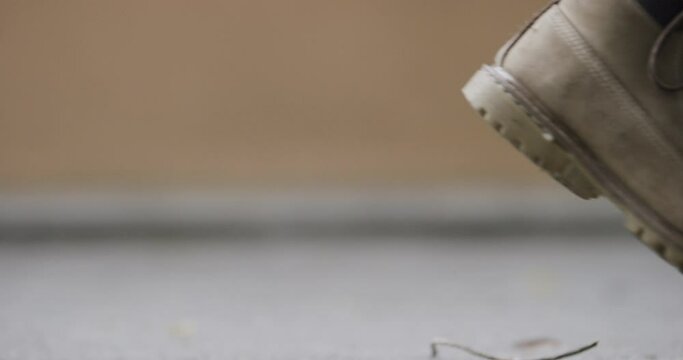 Close up of shoe on prothetic leg walking