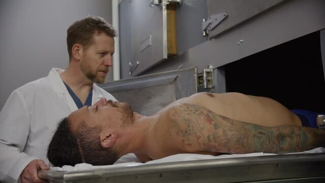 Medical examiner in morgue with corpse