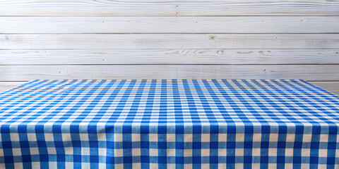 Blue tablecloth on white wooden table with copy space