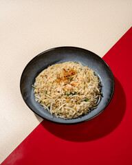 Shrimp fried rice is a dish of rice fried in a pan which produces a different taste because it is mixed with spices and shrimp.