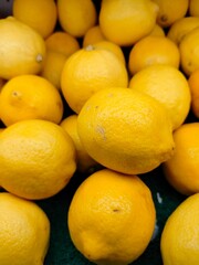 Lemon fruit. Stacked citrus fruits are sold at supermarkets. Sweet fruits are fresh and healthy.