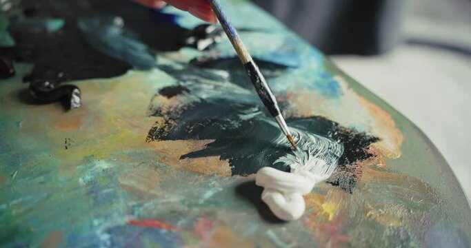 Woman Painting Leopard With Brush in Studio