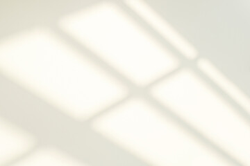 Abstract light reflection and grey shadow from window on white wall background. Gray window shadows...