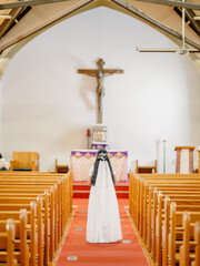 Girl praying in a church on the holy communion day 