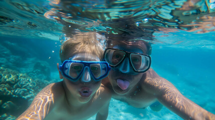 Naklejka premium Underwater Shot of Playful Father and Son with Snorkels