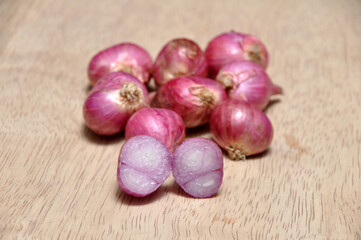 Onions on a wooden table in the kitchen