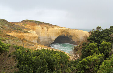 London Arch rock formation with the ocean and seaside plants on the Great Ocean Road in Victoria, Australia