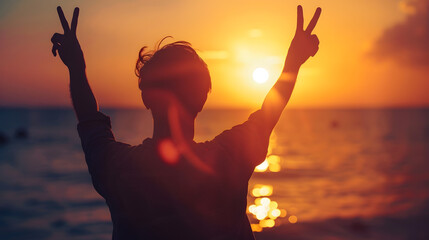 A tranquil silhouette of anonymous person making peace signs with the backdrop of a glowing sunset at sea : Generative AI