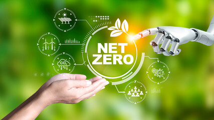 Net zero concept, Robot hand and business hand pointing green energy icon, Applying technology in the organization to lead to net zero emission Idea innovative. green energy blur background..