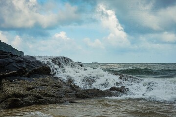 Image of a wave crashing on the rock