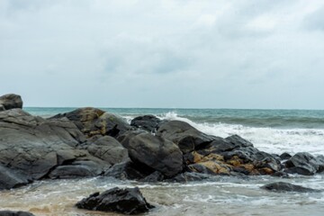 Image of a wave crashing on the rock