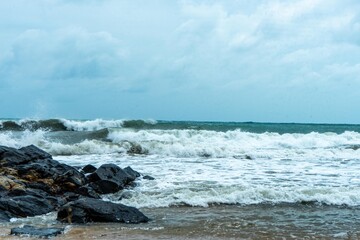 Image of a wave crashing on the rock