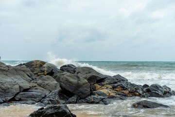Image of a wave crashing on the rock
