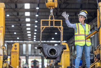 Maintenance engineer uses machine to lift and replace locomotive parts, reducing carbon emissions.