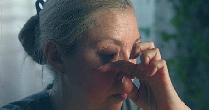 Blonde girl puts on blue colored contact lenses