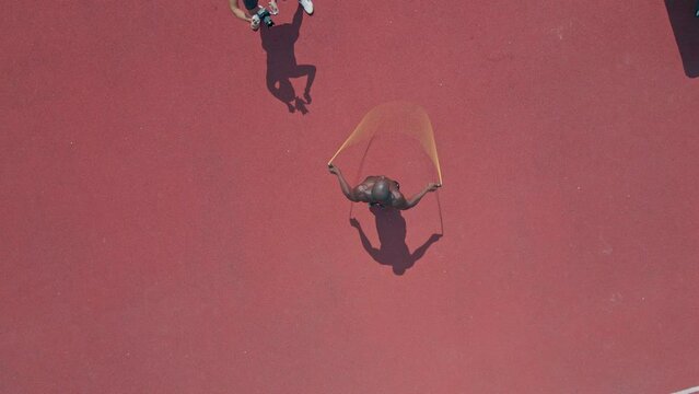 Videographer filiming an athlete skipping the rope