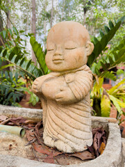 The neophyte sculpture with 
smilingly face in a happiness and peaceful emotion.