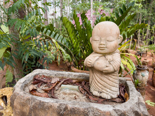 The neophyte sculpture with 
smilingly face in a happiness and peaceful emotion.