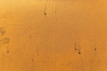 Sand on beach as background, top view