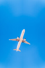 Airplane before landing in blue sky, Airbus A321-200