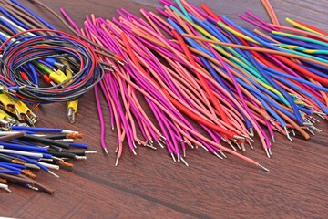 Copper electrical wiring wires in colored insulation for connecting electrical equipment. Close-up. Soft focus.