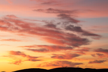 A power pylon isolated in a striking red sunset over the Boland region of the Western Cape province in South Africa