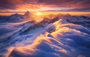 Beautiful mountain peaks in the clouds, a panoramic view of snowcapped mountains with a golden sunset light