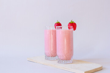Strawberry fresh pink berry smoothie on the table