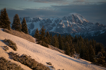 orange sunrise in the austrian alps, the golden hour at a spring morning, with beautiful view of...