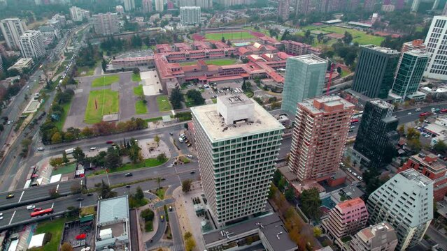 Aerial drone fly above high traffic buildings, Santiago de Chile vibrant capital